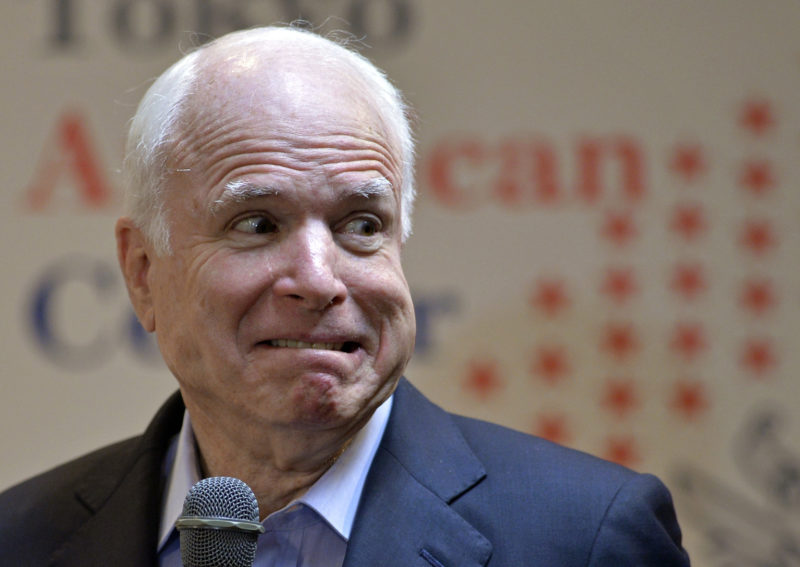 U.S. Sen. John McCain, R-Ariz., reacts as a lightning hit a nearby building while answering to questions from students of the Japan-America Student Conference (JASC) at the Tokyo American Center in Tokyo, Japan, Wednesday, Aug. 21, 2013. (AP Photo/Franck Robichon, Pool)