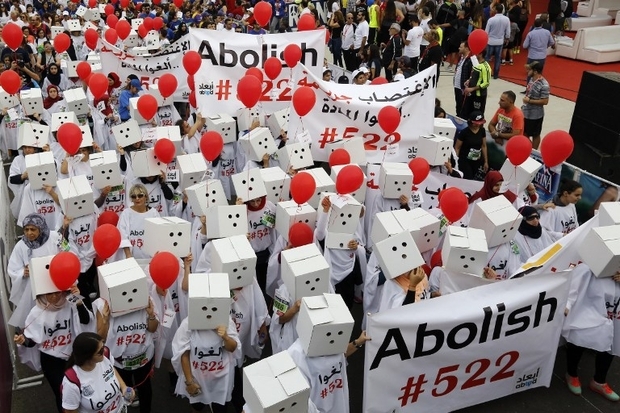 Participants, demanding the abolishment of article 522 of Lebanon's Penal code, take part in the 14th annual Beirut Marathon on November 13, 2016 in the Lebanese capital. Article 522 of Lebanons Penal Code stops prosecution or execution of any penalty when the perpetrator of a rape, kidnapping, or statutory rape marries the person he has raped or kidnapped. / AFP PHOTO / ANWAR AMRO