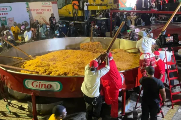 chef Hilda Baci attempts to set a new Guinness World Record for cooking the world’s largest pot of jollof rice.