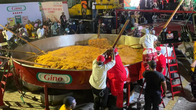 chef Hilda Baci attempts to set a new Guinness World Record for cooking the world’s largest pot of jollof rice.